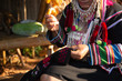 The Akha woman is sewing