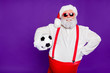 © deagreez - Photo of grey haired santa father holding football ball going to spend newyear night watching champion league wear sun specs costume isolated purple background