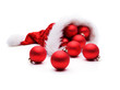 Leinwandbild Motiv Bunte Weihnachtskugeln mit Weihanchtsmütze  isoliert auf weißem Hintergrund