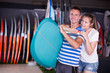 © JackF - Guy with girl buying surfboard