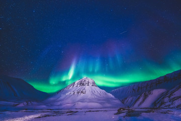 the polar arctic northern lights hunting aurora borealis sky star in norway travel photographer sval