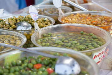 Wall Mural - salting olives, onion, peppers and other salting sold on outdoor spanish market. Food.