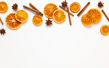  Christmas Composition With Dried Oranges And Spices On White Background. Natural Food Ingredient For Cooking Or Christmas Decor For Home. Flat Lay.