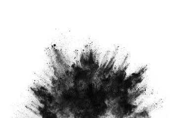Wall Mural - closeup of black dust particles explode isolated on white background..