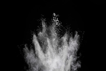 Wall Mural - white powder explosion on black background. colored cloud. colorful dust explode. paint holi.