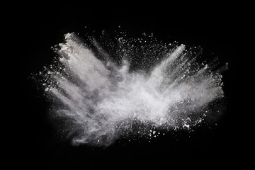 Wall Mural - white powder explosion on black background. colored cloud. colorful dust explode. paint holi.