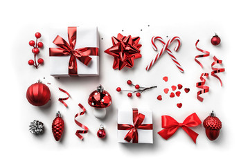 Wall Mural - christmas gift boxes with red ribbon, sparkles, confetti and decoration on white background. xmas an