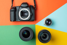 SLR Camera With A Set Of Different Lenses On A Colored Background, The Choice Of Device For The Camera Concept