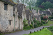 © LAURA - BIBURY, COTSWOLDS, UK - MAY 28, 2018: Traditional cotswold stone cottages built of distinctive yellow limestone in the world famous Arlington Row, Bibury, Gloucestershire, England