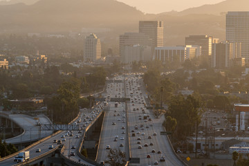 Wall Mural - Hazy morning view of commuters on the 134 Ventura Freeway near Los Angeles in downtown Glendale, California.