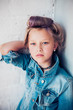Fashion portrait of 8 years old russian girl with colored lilac hair.