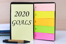 2020 Goals Written In Notepad. Concept Of New Year, Business, Success, Achievement, Reach, Future, Focus, Triumph, Attitude.
