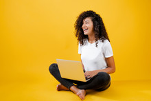 Happy African Black Woman Sitting With Laptop Isolated Over Yellow