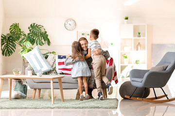 Canvas Print - Happy children meeting their military father at home