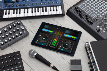 Mixing music on tablet with electronic music instruments concept