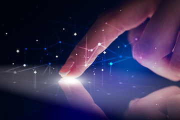 Poster - Finger touching tablet with global network concept and dark background
