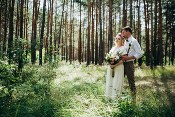 Beautiful wedding couple in a forest