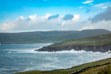 Wall Mural - a viewpoint from bray head on valentia island in the ring of kerry in the south west coast of ireland during an autumn sunset showing the skellig islands and watchtower