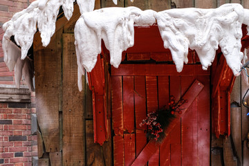 Wall Mural - vintage wood house door with winter snow closeup