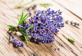 Fototapeta Lawenda - Bunch of lavandula or lavender flowers on the wooden background.