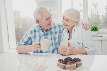 Poster - Close up photo of lovely couple hold hand beverage mug enjoy weekend sit table indoors