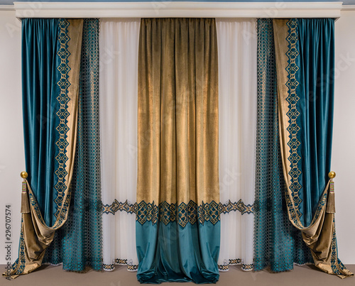 Cuadros en Lienzo The green double-sided velvet curtains with embroidery and a luxurious gold brus