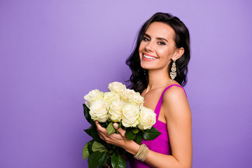 Sticker - Close-up portrait of her she nice rich fashionable attractive lovely charming cheerful wavy-haired lady holding in hands fresh white roses isolated over violet purple lilac pastel color background