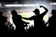 © terovesalainen - Fight in a football game crowd. Angry man hitting another spectator in soccer match audience. Violent argument between two fans of different teams and clubs. Hooligans and violence in sport event.