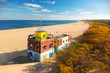 Aerial landscape of the beautiful beach with lifeguards house at Baltic Sea in Gdansk, Poland