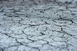 Photo of cracked dry land soil, selective focus