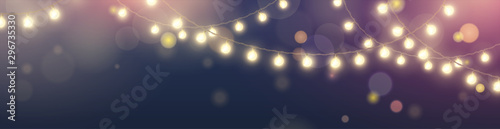 Photographie Vector horizontal banner with string of realistic hanging yellow lights garlands on dark blue background with effect bokeh