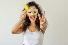 Young Woman Smiling Holding Carnival Mask On White Background