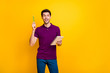 Portrait of his he nice attractive genius focused cheerful cheery glad guy creating making notes cool idea isolated over bright vivid shine vibrant yellow color background
