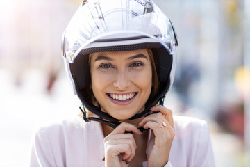 Wall Mural - Beautiful young woman wearing helmet