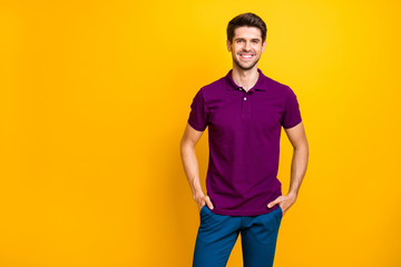 Poster - Photo of confident cheerful reliable business person holding his hands in pockets smiling toothily beaming looking successful isolated over yellow vivid color background