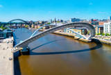 Half open Millennium bridge during the sunny day in Newcastle, UK