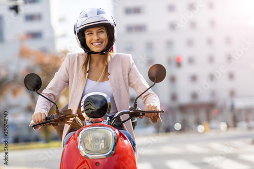 Fotomural Woman Riding Scooter In The City