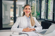 © bnenin - Portrait of a cheerful female doctor in medical office.