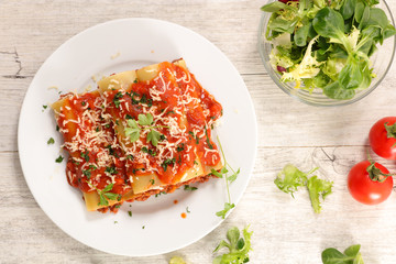 Canvas Print - cannelloni with minced beef and tomato sauce and cheese