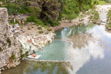 Fototapeta  - Tourist in hot springs Bagni di Petriolo - Monticiano in Italy.