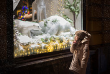  Little Girl Stands On The Streets At The Window On Christmas Eve