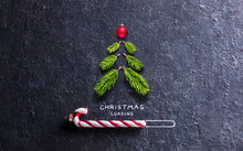 Christmas Card - Loading Concept - Tree And Candy Canes On Black Stone