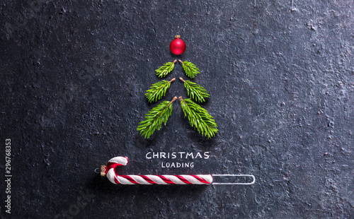 Cuadros en Lienzo Christmas Card - Loading Concept - Tree And Candy Canes On Black Stone