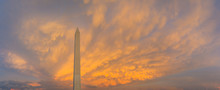 Panorama Of The Washington Monument During Sunset With The Clouds Behind The Monument Lite In Brilliant Evening Colors.