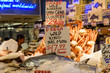 © parkerspics - Fresh fish for sale in a farmers market.  The fish is laid out in ice, and labled.  The market is the famous Pike Place market, in Seattle