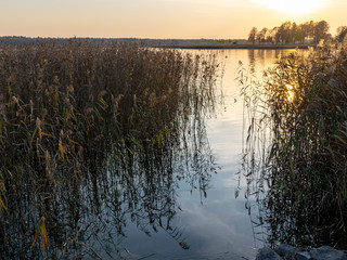 Wall Mural - evening view of the lake at sunset, calm and slow water