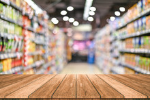 Empty Top Wooden Table With Supermarket Blur Background