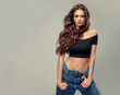 © Sofia Zhuravetc - Stylish sexy beautiful  woman model in  jeans hipster clothes  . girl with curly hair is wearing trendy , denim and a short top.