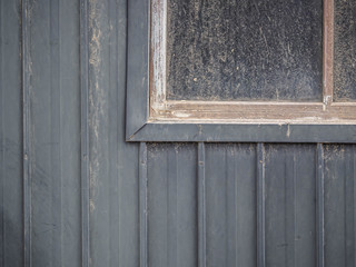 Wall Mural - Abstract background of house or home or resident old metal or aluminum zinc wall and window frame with wooden window frame and dirty glass texture. Vertical striped pattern.