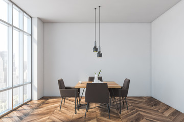 Cozy white dining room with window